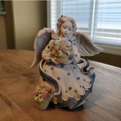 f9e7d203fb640f8934193cc9d61927c5_preview_featured.jpg Free STL file Angel holding Flowers・3D printable object to download
