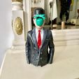E.jpg Surrealist Mystery Bust – Magritte-Inspired 'Son of Man' Sculpture