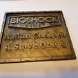 20180929_163912.jpg Bioshock "Man chooses, slave obeys" weathered plaque.