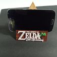 IMG_20230403_120416869.jpg ZELDA LINK'S AWAKENING TRIFORCE PHONE STAND, TEALIGHT