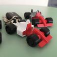 IMG_20221030_194854.jpg keychain, phone holder and formula 1 car toy