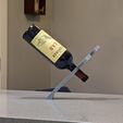 Wine-bottle-balancing-trick-gift-idea-for-spouse-wife-or-husband.jpg Balancing wine bottle holder gag gift