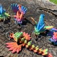 346105712_988675775824036_7817212880528366632_n.jpg Free STL file Rainbow Dragon Keychain・Design to download and 3D print