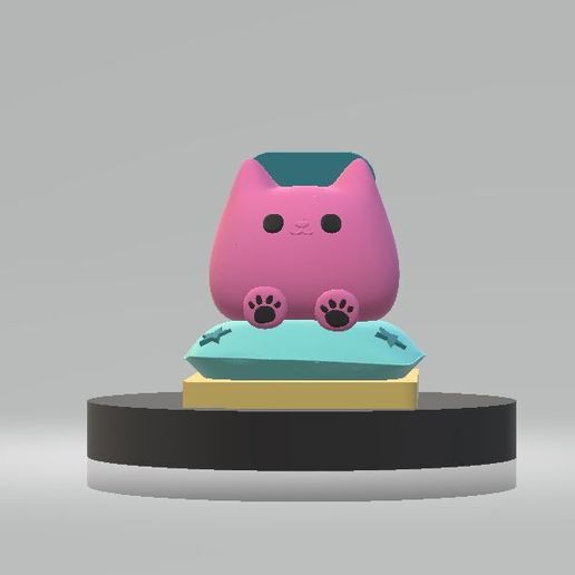 Cute Pink Kitty Sitting on a Blue Pillow