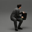3DG-0002.jpg businessman sitting and holding briefcase of money