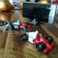 IMG_20221030_195528.jpg keychain, phone holder and formula 1 car toy