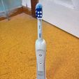 tbs01.jpg Oral-b Toothbrush & Clock Stand