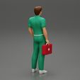 3DG-0003.jpg paramedic Standing And Holding first Aid box