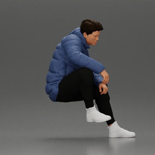3DG-0002.jpg Street performer crouching low in blue puffer jacket athletic stance sitting