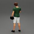 Girl-0005.jpg Muscular man working out in gym doing exercises with dumbbells at biceps