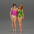 3DG-0001.jpg Two girl in bikini hugging on the beach