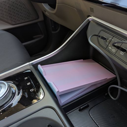 PXL_20251202_192101224.jpg Kia Carnival Hybrid Phone Cubby Riser