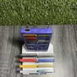 441211775_1218980595748450_7937310151269126079_n.jpg GAMEBOY COLOR HOLDER / STAND WITH 8 GAME CARTRIDGES CASES