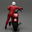 3DG-0005.jpg Motorbiker standing pushing his motorbike