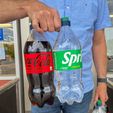 IMG_1236.jpg Bottle Buddy: Universal Soda Bottle Carrier with Ergonomic Handle & Magnetic Storage – Fits Most 1L to 2L Bottles Worldwide