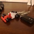 IMG_20221030_200005.jpg keychain, phone holder and formula 1 car toy