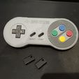 photo_2024-08-30_22-07-18.jpg SUPER NINTENDO KEYCHAIN AND HOLDER
