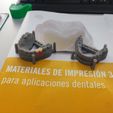 Imagen-de-WhatsApp.jpg Modelos dentales con encía falsa y resina biocompatible / Dental model with false gum and biocompatible resin.