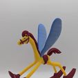 PXL_20260216_203734857.jpg Alice in Wonderland rocking horse figurine