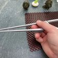 Marcosticks_3D-printed M20 large training chopsticks with M22 ring finger helper enabling bent thumb - closed posture_IMG_1250_FRD-scaled.jpg Finger Helpers for Training Chopsticks