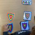 received_1327461438084750.jpeg Juego de puzzle de escudos