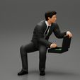 3DG-0001.jpg businessman sitting and holding briefcase of money