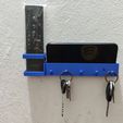 z7027631273908_568b46da9dbdcea7c7b2be5686be1551.jpg Key ring with phone and remote control holder