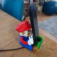 1000014623.jpg Mario Phone Holder