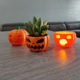 angry-pump.jpg Two angry and one surprised Halloween pumpkins (candle holder, plant base, and candy bowl)