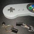 photo_2024-08-30_22-07-18-6.jpg SUPER NINTENDO KEYCHAIN AND HOLDER