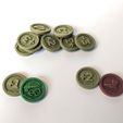 PXL_20220505_105058165.jpg Command tokens for futuristic wargame of the 40th millennium