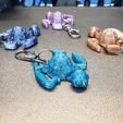 20231112_024428-1.jpg Turtle Keychain (made from recycled bottles)