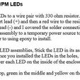 Wire and Mount AM/PM LEDs Wire each of the six LEDs to a wire pair with 330 ohm resistor. I soldered the resistor to the LED short lead (+) and then a red wire to the resistor. I soldered a black wire to the long lead (-) and I covered the solder connections with heat shrink. T connected each LED assembly to a temporary power source to ensure they were operating properly prior to using epoxy to install. Now that you have the LED assemblies, Stick the LED in its associated LED hole and bend the leads over. Once you installed the LEDs in the holes, mix some epoxy and pour a small amount over each LED on the inside of the enclosure. Remember red on the top, green in the middle and yellow on the bottom. Back to the Future Time Circuit 3D Printed Clock