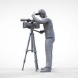 Cameraman2.37.jpg N2 Cameraman avec chapeau et casque caméra sur trépied