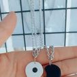 IMG_20250410_110827_767.jpg shared yin-yang heart charms