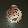 20230727_172217.jpg children's medal with a smiley face