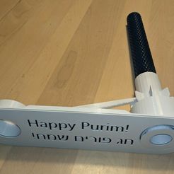 d9804794-5f07-47cb-b3ca-f5ff0c083b03.jpg Бесплатный 3D файл Humongous Purim Gragger Remix - With Knurled Handle & Debossed Purim Message・3D-печатная модель для скачивания