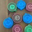 relax-spin-play.jpeg Spinning Alphabet Pack STL (A–Z) – Print-in-Place Letter Keychains / Educational Fidget Letters