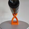 Sand_Timer_Wine_Bottle_Holder3.jpg Hourglass sand timer shaped balanced bottle holder