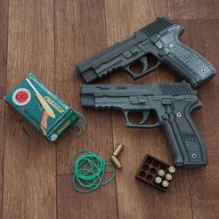 Blowback and shell ejecting rubber band gun (Sig Sauer P226)