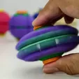 e881318a47fd80dc.webp HelixCore – Press-to-Spin Squishy Ball