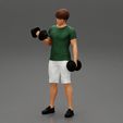 Girl-0001.jpg Muscular man working out in gym doing exercises with dumbbells at biceps