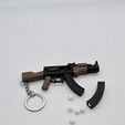 20250902_000107.jpg AK-47 Keychain — Functional Blaster Toy