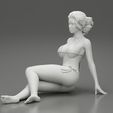 3DG-0012.jpg Femme sexy assise en bikini sur la plage