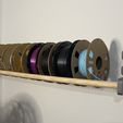 IMG_9611.jpeg Archivo STL gratuito Soporte de pared para rollos de filamento・Objeto para descargar e imprimir en 3D