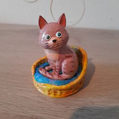 Cute sitting cat + basket