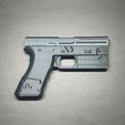 IMG_20240229_154302.jpg Puntal para pistola Glock con accesorios