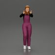3DG-0001.jpg Smiling girl in overalls showing a thumbs up with both hands