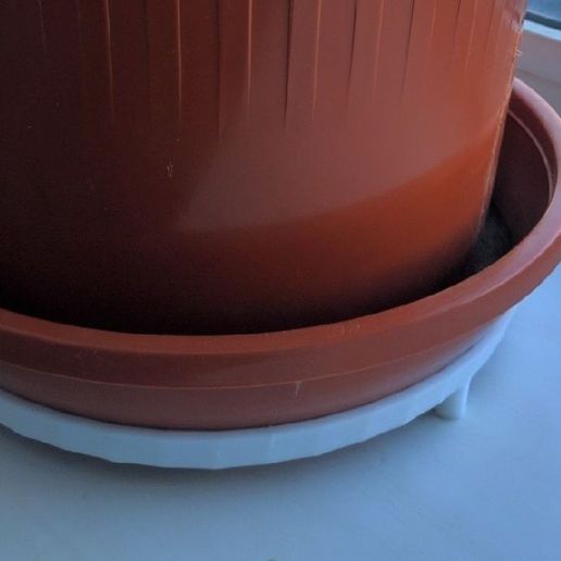 Stand on legs for a flower pot on the windowsill