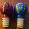 519114f4-60c8-42e5-bdc6-16266309e42e.jpg Horde and Alliance Themed Bottle Stoppers